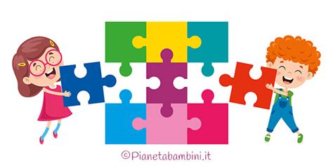 Bambini che dipingono un grande puzzle con pezzi colorati